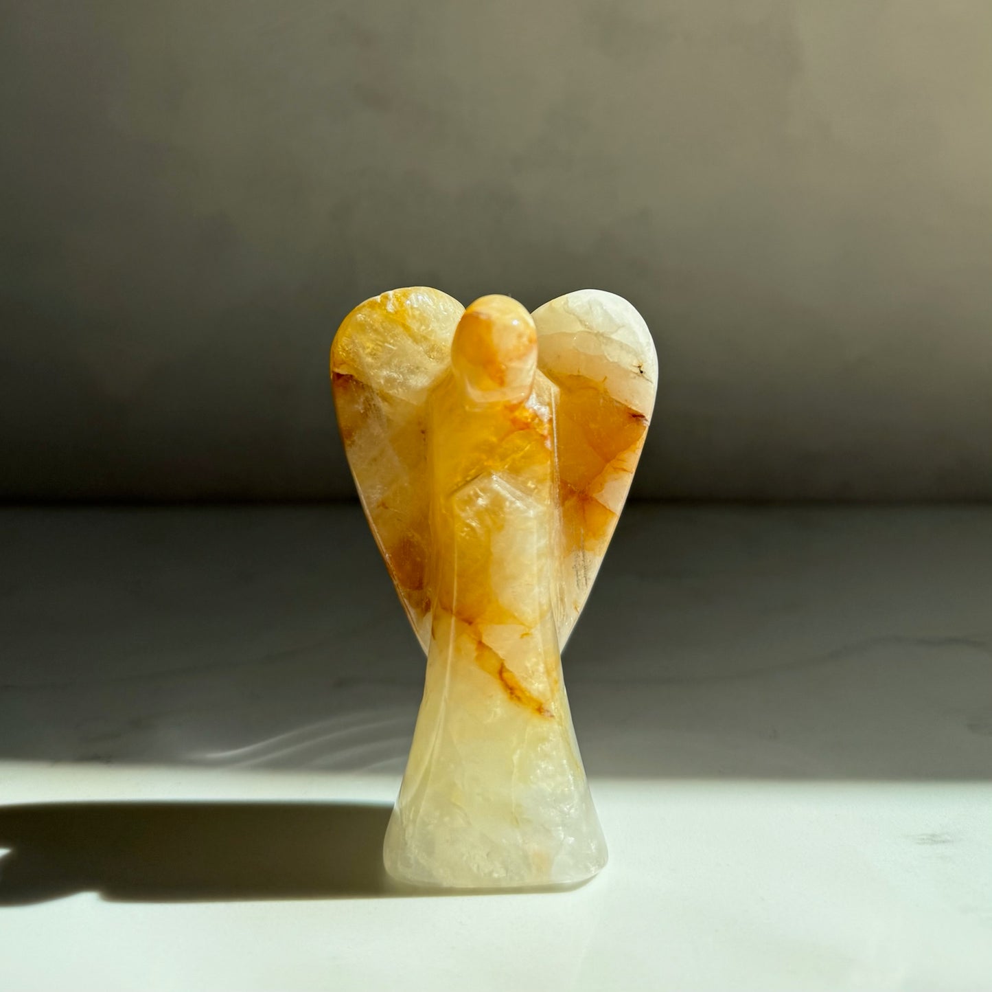 Guardian of Healing — hand-carved Golden Healer Quartz crystal angel, artisan healing crystal gift symbolizing strength, protection and hope