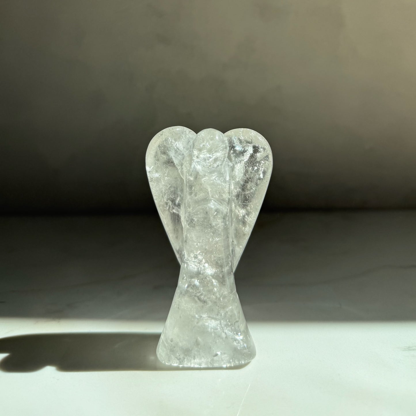 Guardian of Light — hand-carved Clear Quartz crystal angel, artisan healing crystal gift symbolizing clarity, light and new beginnings