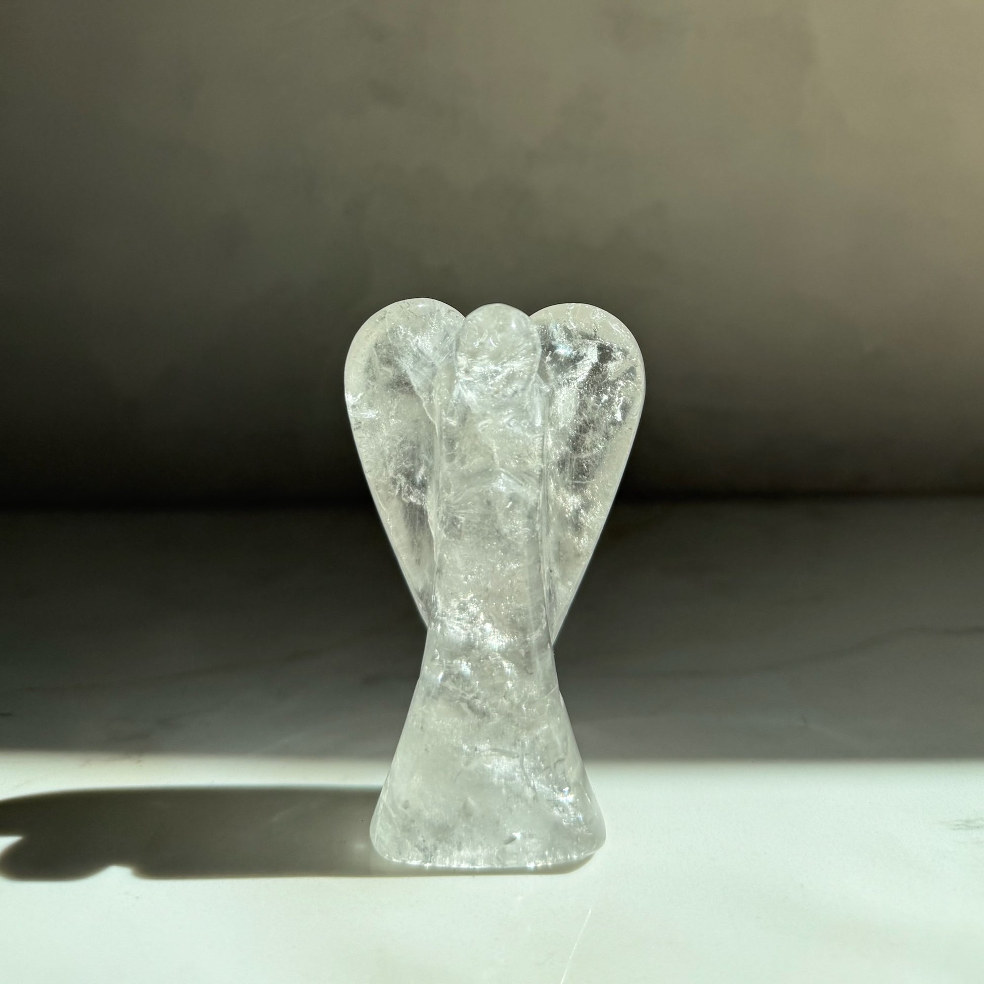 Guardian of Light — hand-carved Clear Quartz crystal angel, artisan healing crystal gift symbolizing clarity, light and new beginnings